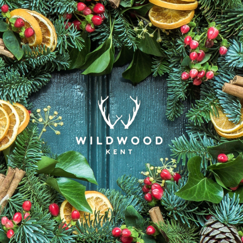 Festive wreath with Wildwood Kent logo